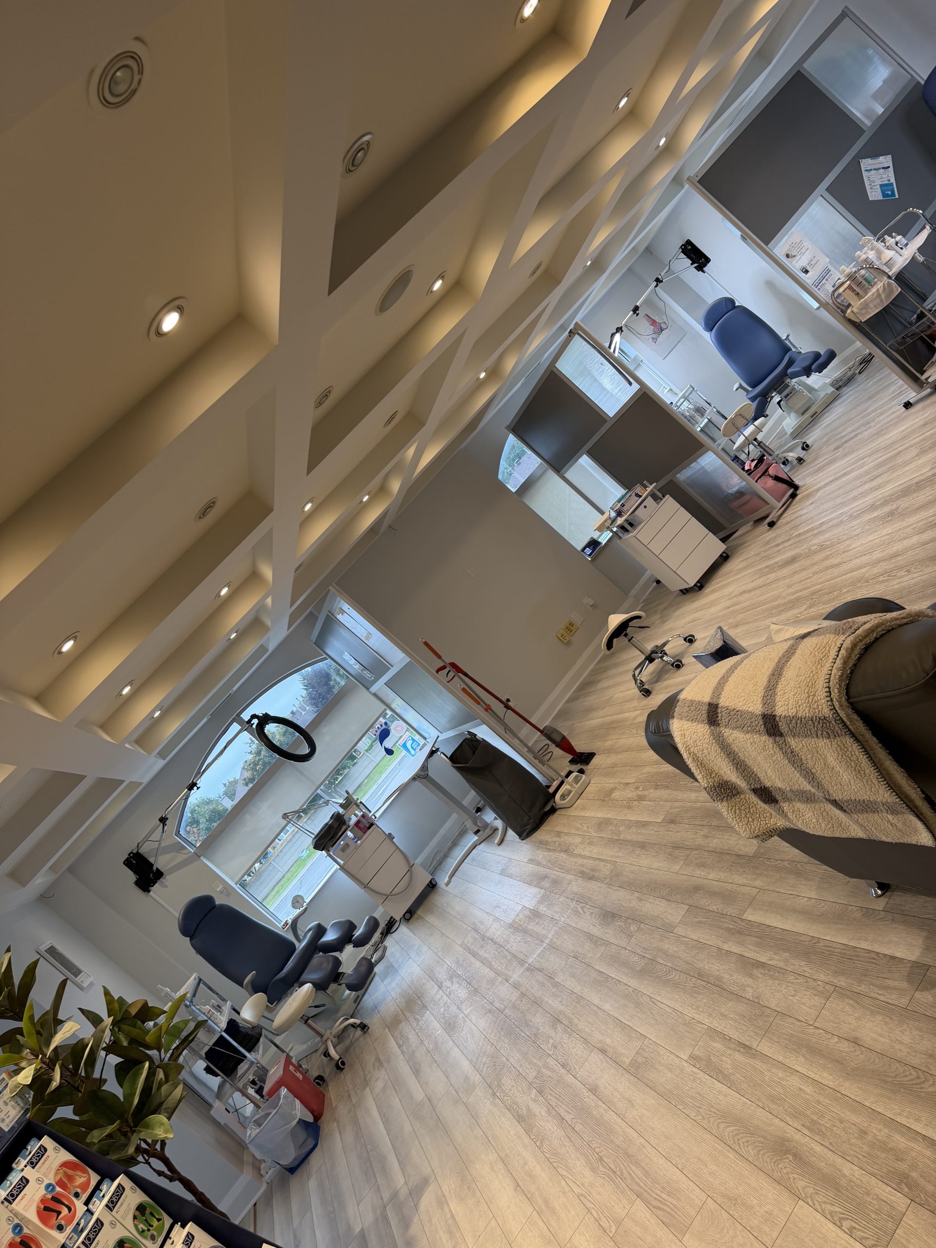 TiredSole™ clinic interior with several treatment stations and privacy screens